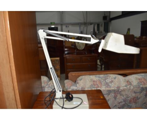A vintage Luxa magnifying angle poise lamp