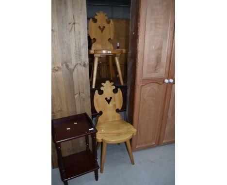 A pair of vintage pine shield back hall chairs