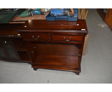 A reproduction Regency style low shelf unit with two frieze drawers, width approx. 76cm