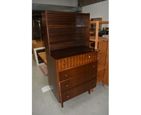 A vintage mahogany dresser of stylised form having display shelf back over three drawers, the top being compartmented, width 