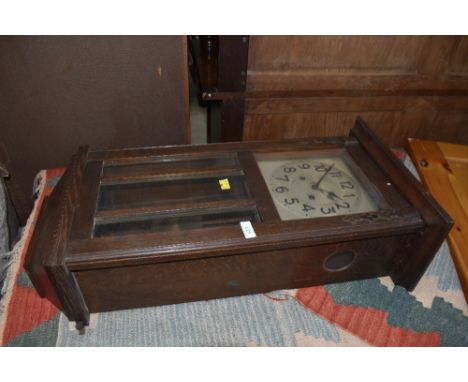 An early 20th Century oak cased wall clock