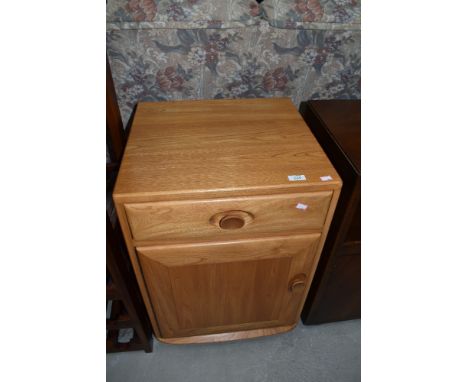 A light Ercol bedside cabinet