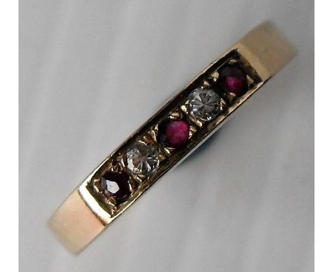 A 9ct yellow gold ruby and diamond half-hoop ring; three rubies measure 2mm each approx., two diamonds measure 2mm each appro