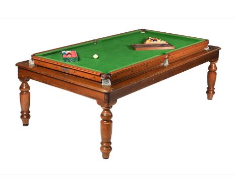 A VICTORIAN OAK AND MAHOGANY METAMORPHIC SNOOKER/DINING TABLECIRCA 1900The top revolving to reveal the snooker table, one sid