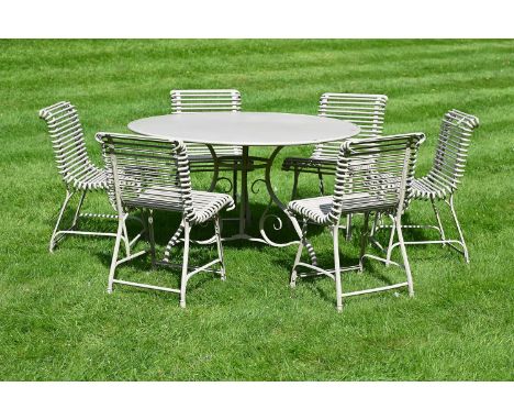 A SET OF GARDEN FURNITURE COMPRISING A CIRCULAR TABLE AND SIX CHAIRSMODERN, ATTRIBUTED TO ARRAS FURNITUREThe table 73cm high,