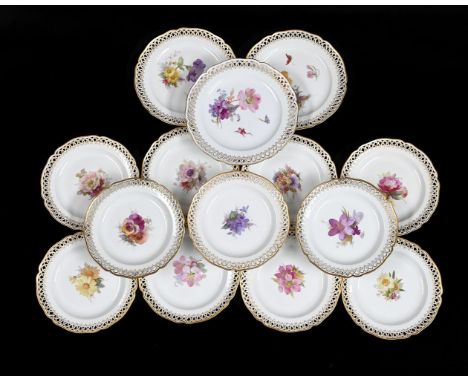 A BERLIN (K.P.M.) PART DESSERT SERVICECIRCA 1910painted with flowers within pierced borders, the larger plates painted with i