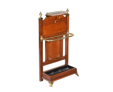 AN AESTHETIC MOVEMENT OAK AND BRASS MOUNTED HALL STANDCIRCA 1890, ATTRIBUTED TO JAMES SHOOLBRED & CO The raised shelf with br