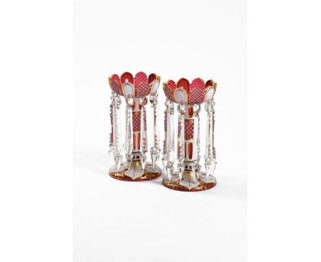 A PAIR OF BOHEMIAN RUBY AND OPAQUE WHITE OVERLAY GLASS LUSTRESTHIRD QUARTER 19TH CENTURY30cm highProvenance: From the Private