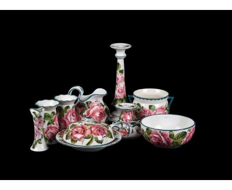 A SELECTION OF WEMYSS CABBAGE ROSE POTTERYMOSTLY LATE 19TH CENTURYIncluding a candlestick, 31cm high, a jug, muffin dish and 