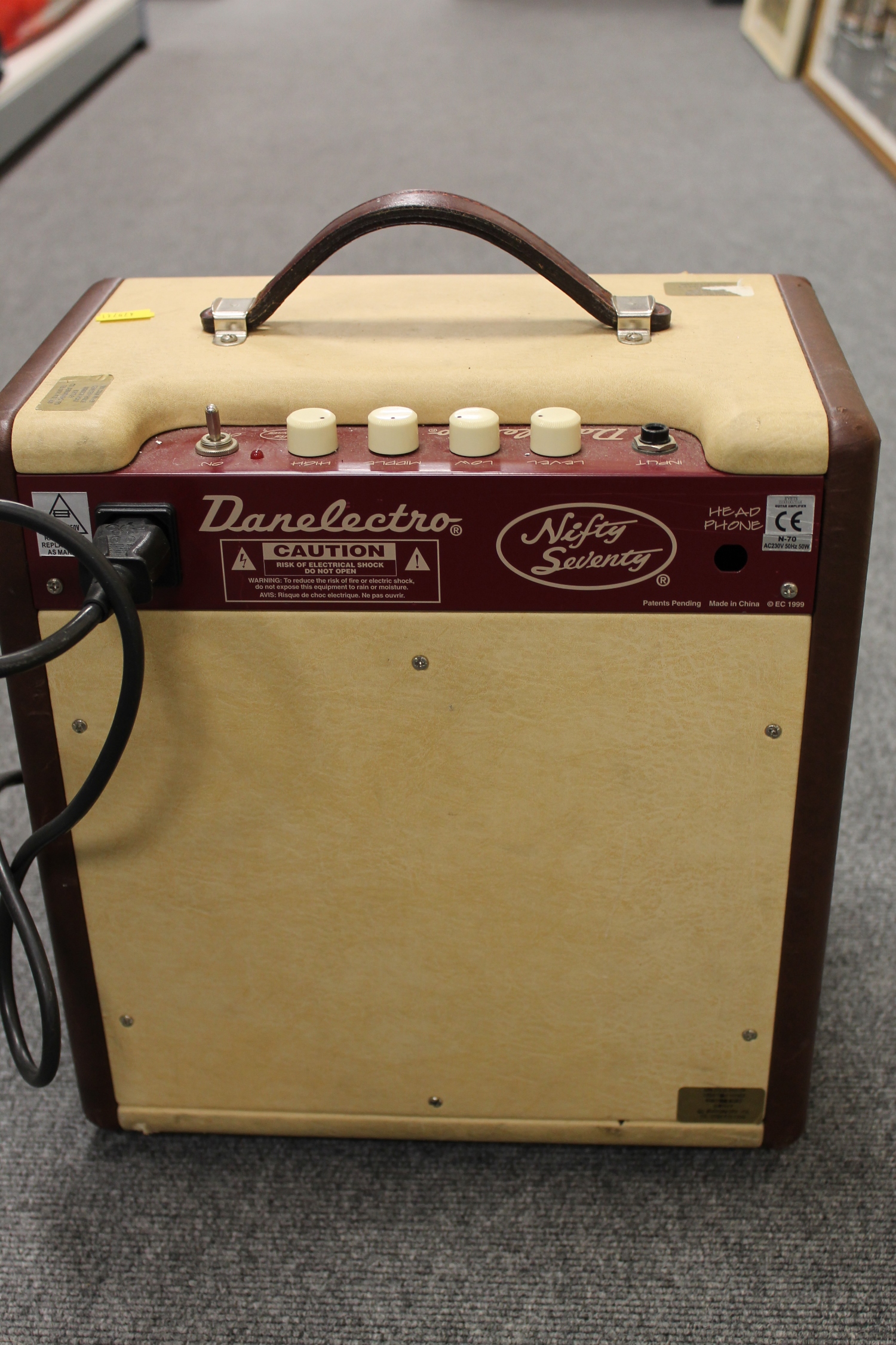 A vintage Danelectro amplifier 'Nifty Seventy', together with music stands, condenser microphone