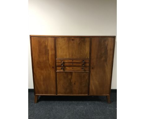 A mid 20th century mahogany sideboard, fitted with cutlery drawers and panel doors, width 152 cm 