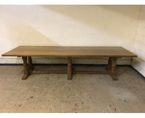 An impressive Robert 'Mouseman' Thompson of Kilburn 11ft adzed oak five-plank refectory dining table, 336 cm x 105 cm, on tri