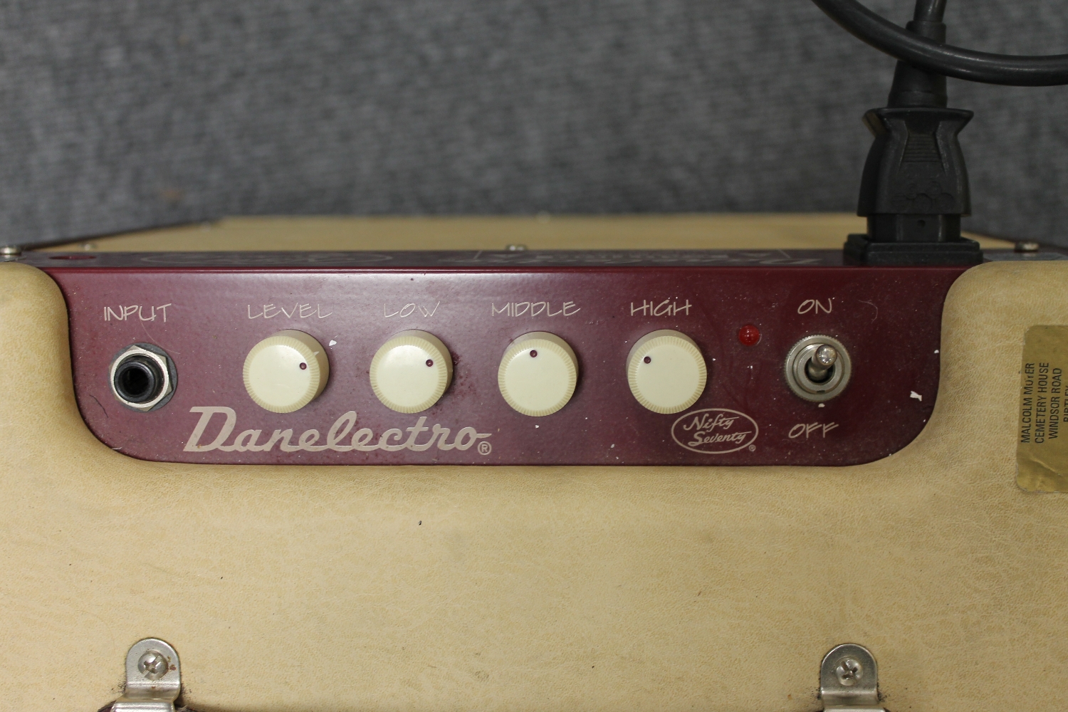 A vintage Danelectro amplifier 'Nifty Seventy', together with music stands, condenser microphone