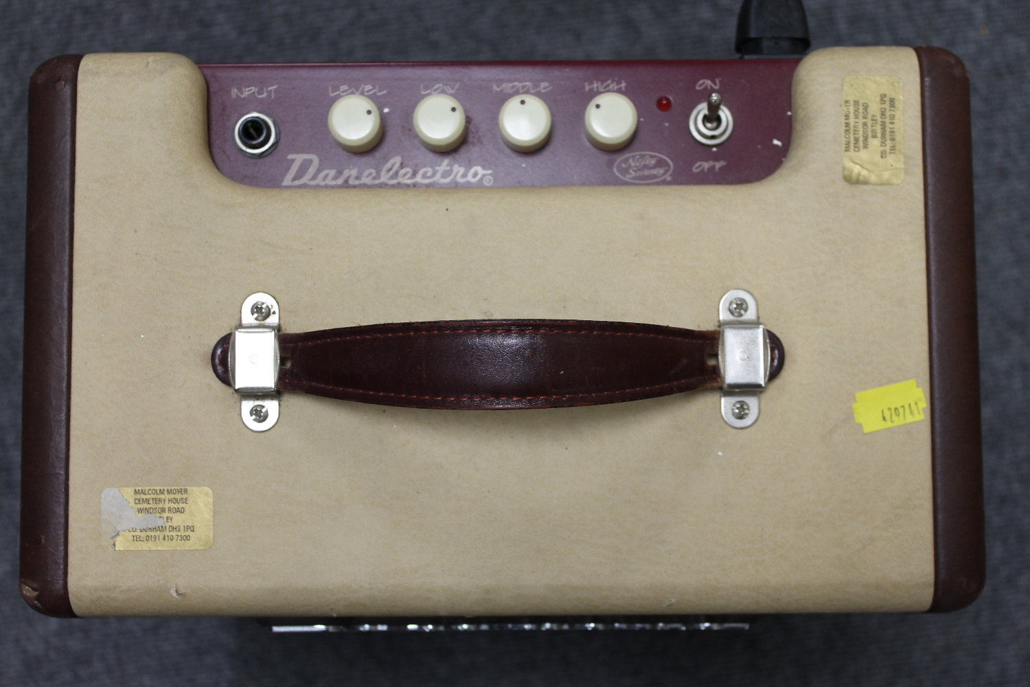 A vintage Danelectro amplifier 'Nifty Seventy', together with music stands, condenser microphone