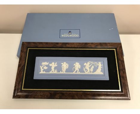 A Wedgwood Jasper Ware framed panel depicting cherubs, 34 cm x 19 cm, boxed CONDITION REPORT: Some surface wear but generally
