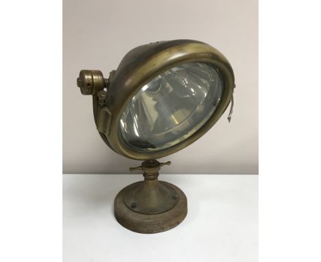 An early twentieth century brass speedboat lamp by C A Vandervell and Co, London, height 40 cm. CONDITION REPORT: Dent to bac