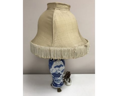 An 18th century Chinese blue and white vase, converted to a table lamp with gilt mounts, vase height 24 cm.