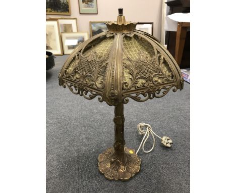 A mid 20th century continental style brass table lamp, the base decorated in foliage, height 70 cm. 