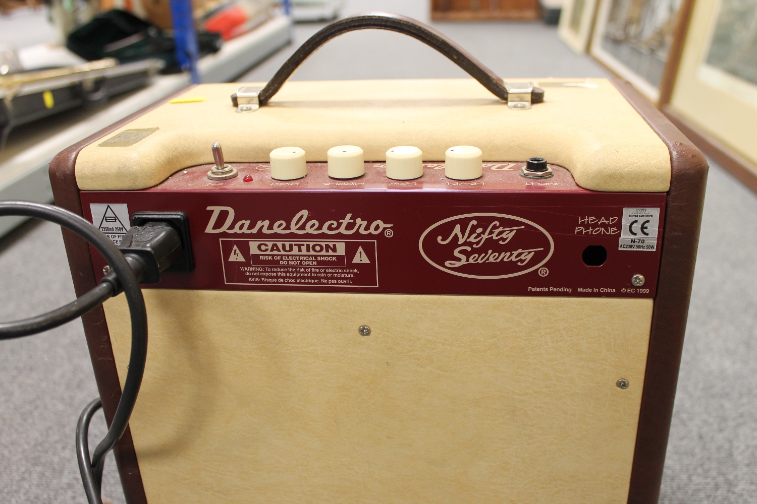 A vintage Danelectro amplifier 'Nifty Seventy', together with music stands, condenser microphone
