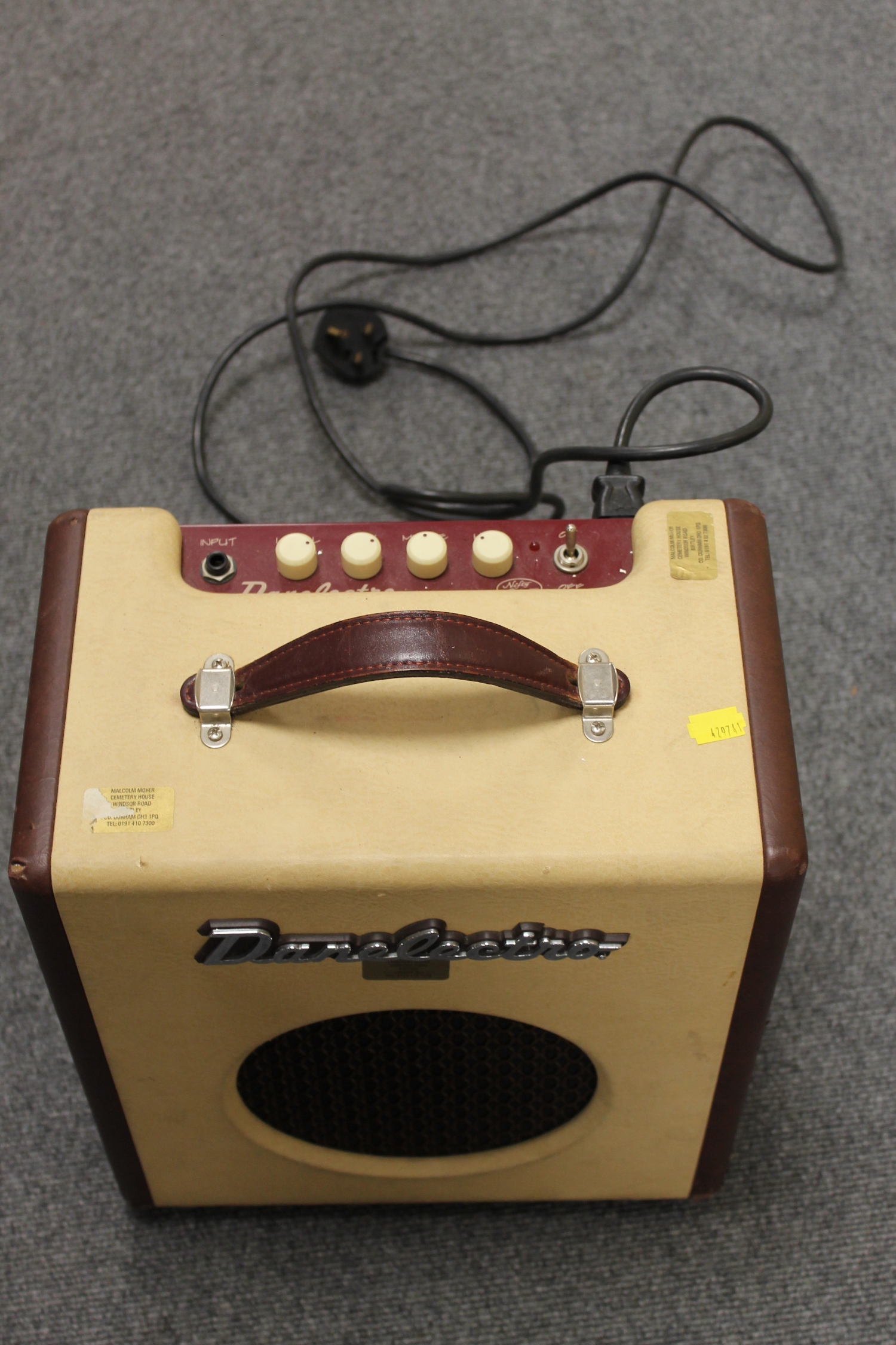 A vintage Danelectro amplifier 'Nifty Seventy', together with music stands, condenser microphone