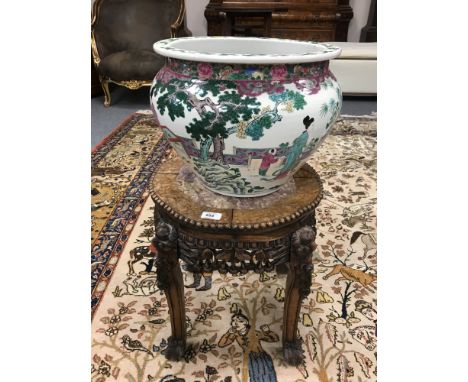 A Chinese hardwood plant pedestal inset with rouge marble, height 45 cm, diameter 40 cm, together with a Chinese planter. (2)