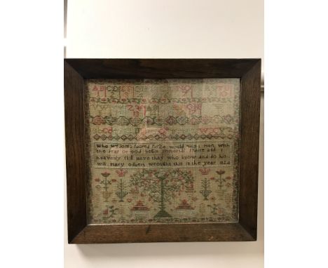 An early 19th century tapestry sampler, dated 1824, 33 cm x 31 cm, in rosewood frame.
