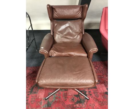 A mid twentieth century Scandinavian brown leather relaxer chair and stool. (2)