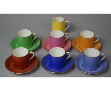 A Paragon Harlequin Set of Six Coffee Cans and Saucers and a Milk Jug 