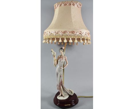 A Reproduction Figural Table Lamp in the Form of Flapper Girl with Parrot, Arm Glued, Complete with Shade, Total Height 66cm 