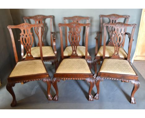 A Set Of Six Chippendale Style Mahogany Dining Chairs, each with a pierced carved back above a drop in seat raised upon carve