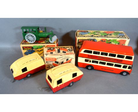 A Triang Minic Scale Model Clockwork Bus with original box together with two Minic Caravans and a Minic Steam Roller, boxed 