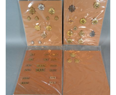 A Collection Of Cap Badges Army Service Corps Australian, Canadian and others on four cards 