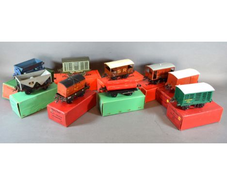 A Hornby Trains 0 Gauge No.50 Gas Cylinder Wagon together with a No.50 hopper wagon, a tipper truck, two milk vans, a flat be