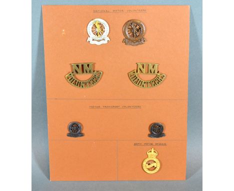 Four National Motor Volunteers Cap Badges together with two Motor Transport Volunteers and an Army Motor Reserve cap badge 