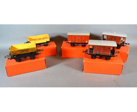 A Hornby Trains 0 Gauge No.50 Rotary Tipping Wagon within original box together with a No.50 goods van, a No.50 goods brake v