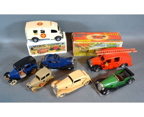 A Triang Minic Clockwork Fire Engine together with a Police Car, an Ambulance, a Taxi and three cars 