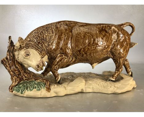 Ceramic figure of a bull by Heredities, approx 37cm in length