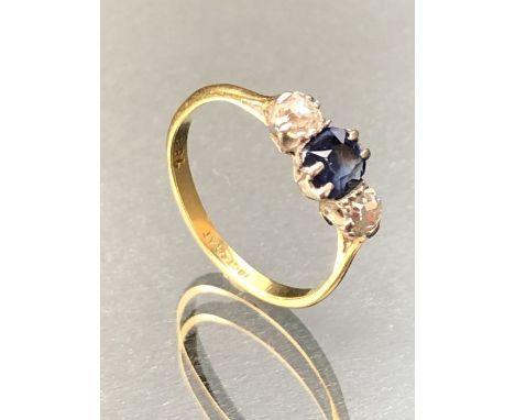 18ct Gold ring with a faceted Sapphire and two Diamonds either side, approx size 'O'