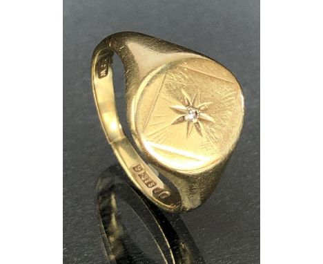 9ct Gold signet ring with starburst design and set with a single diamond to centre approx size 'R' &amp; 5g