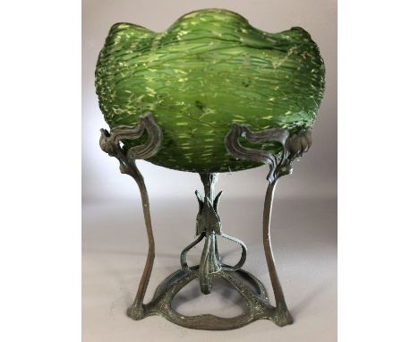 Art Nouveau green glass bowl with crinkled rim elevated on a copper stand with leaf design in the manner of WMF, approx 25cm 