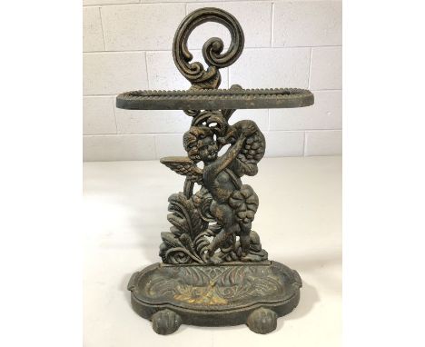 Wrought iron stick / umbrella stand depicting a winged cherub, approx 60cm tall