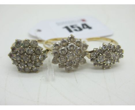 Three Modern Cluster Dress Rings, stamped "375"claw set throughout (finger sizes R) (total weight 10grams). (3) 
