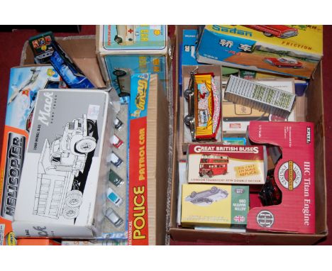 Two boxes of mixed diecast vehicles and tinplate toys to include an Ertl Titan engine, Atlas editions Great British series di