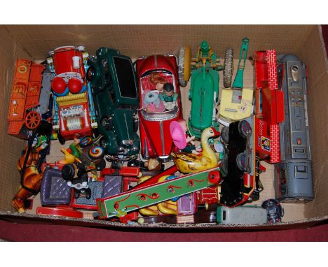 A large box of various tinplate toys to include Marx reversible plastic and tin plate tractor, a modern release Japanese open