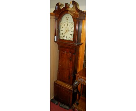 A George III oak and mahogany longcase clock, the arched painted dial having twin winding holes and subsidiary seconds dial, 