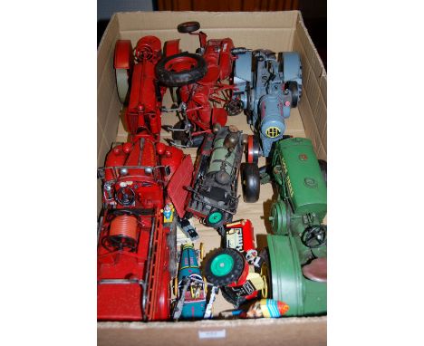 A quantity of reproduction pressed metal large scale vehicles to include farmall tractor, John Deere tractor, fire engine and