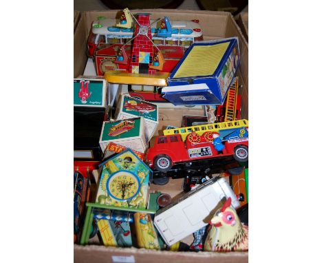 A large box of mixed tinplate toys and diecast vehicles to include Schylling, Matchbox Models of Yesteryear, and others, exam