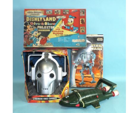 A Cyberman Voice Changer, boxed, a Chad Valley Disneyland Give-a-Show Projector, boxed, a Carlton International Media Ltd Thu