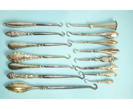 A collection of fourteen miniature silver-handled button hooks, (14).