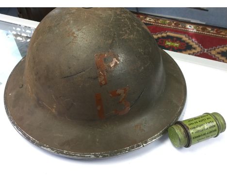 WW2 British Home Front Steel Helmet. Smooth khaki paint and marked "P 13" to front in light brown paint. Liner marked size "7